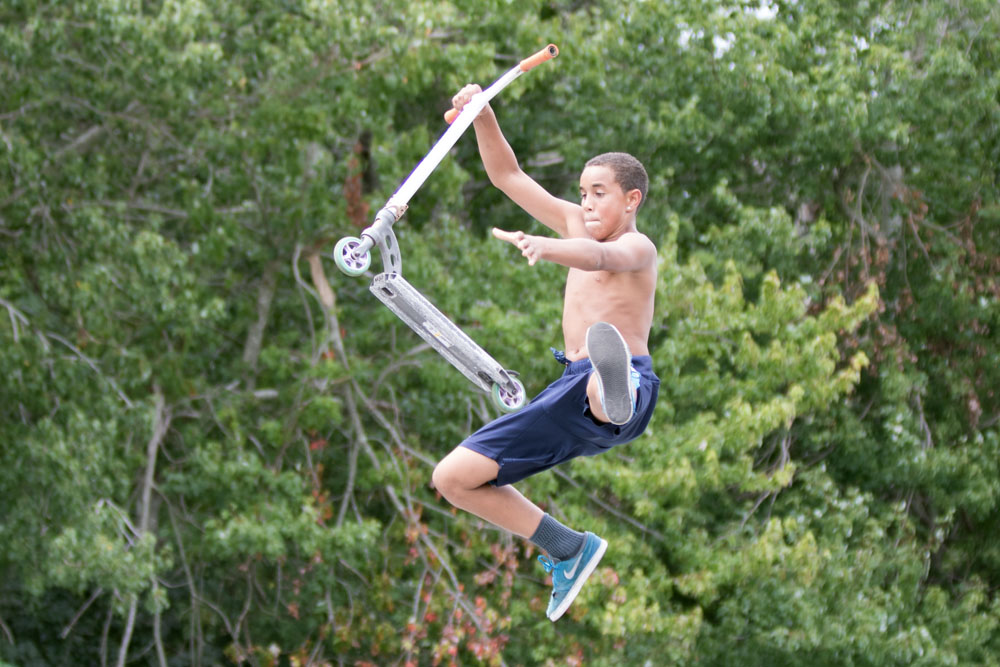 Isaiah Johnson, 12, of Southold does a stunt in mid-air.