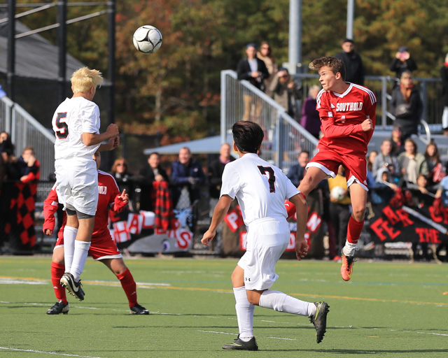 Southold's Joseph Silvestro  heads the ball toward Pierson's Ariel Quiros  during Southold's 1-0 loss to Pierson in the Class C finals at Diamond in the Pines in Coram Saturday. (Credit: Daniel De Mato photos)