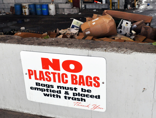 While signs urging residents not to include plastic bags with recyclables are clearly visible at the Southold Town Transfer Station on Cox Lane, residents who use private carters might not be getting this important message. (Credit: Grant Parpan)