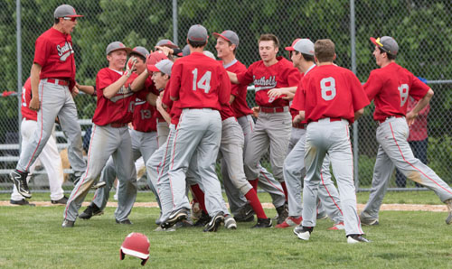 Southold players rushed onto the field after Liam Walker's two-out single brought in the winning run in the eighth inning. (Credit: Katharine Schroeder)