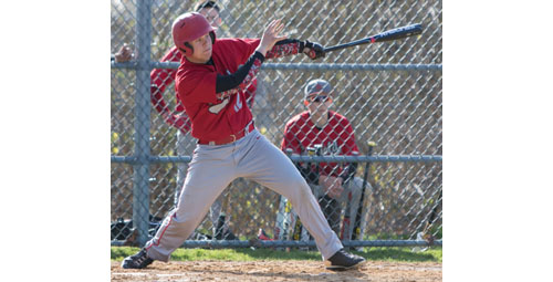 Southold's Alex Poliwoda makes a connection on a pitch during Thursday's game against Pierson/Bridgehampton. (Credit: Katharine Schroeder)