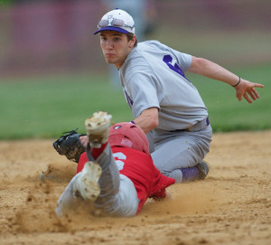 GARRET MEADE PHOTO | Port Jefferson second baseman Ben Kluender tagging out Southold's Sean Moran on an attempted steal in the third inning.