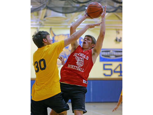 Southold's Aidan Walker goes up for a shot while being guarded by Shoreham-Wading River's Kieran Qualley. (Credit: Daniel De Mato)