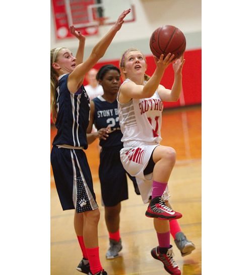 GARRET MEADE FILE PHOTO | One of Southold/Greenport's seven seniors, Justina Babcock, looks for room to shoot as Stony Brook's Annie Skorobohaty blocks her path.