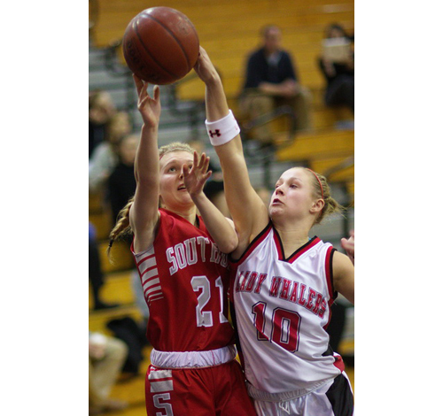 Southold/Greenport's Justina Babcock, left, and Pierson/Bridgehampton's Kasey Gilbride both get a hand on the ball. (Garret Meade photo)