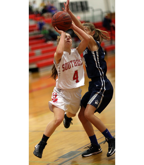 Southold/Greenport's Madison Tabor moves around Stony Brook's Anne Skorobohaty to attempt a layup. (Credit: Garret Meade)
