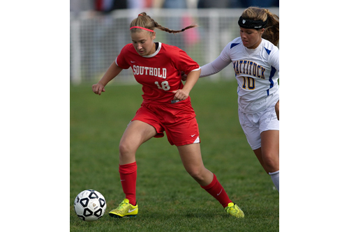 Southold/Greenport's Jillian Golden is challenged for the ball by Mattituck's Catherine Hayes. (Credit: Garret Meade)
