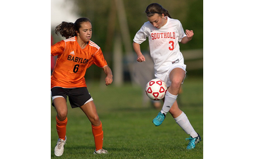Babylon's Olivia Maldonado, who scored twice, and Southold/Greenport's Sabrina Basel in action during Thursday's game at Southold High School. (Credit: Garret Meade)