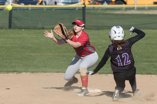 Southold/Greenport second baseman Paige Messana awaits a throw as Hampton Bays' Meghan Harris slides into second base. (Credit: Katharine Schroeder)