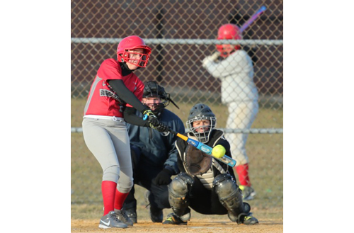 Stephanie Clark connecting for Southold/Greenport's second hit of the game. (Credit: Daniel De Mato)