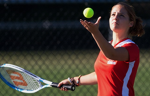 Southold/Greenport junior Julia Daddona tossing the ball before serving during her third singles match against Center Moriches. (Credit: Garret Meade)