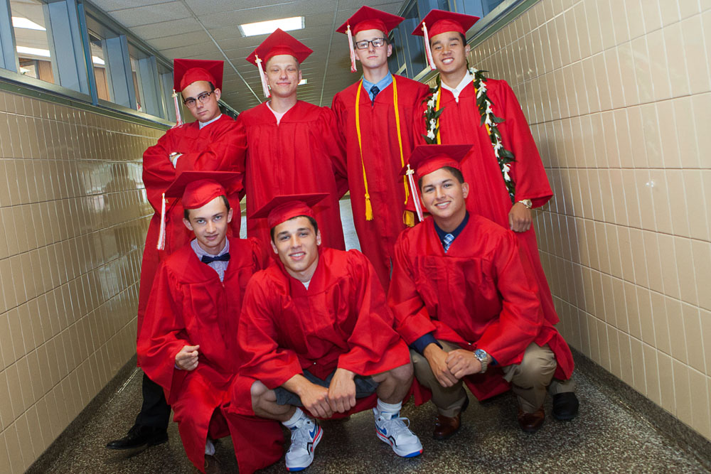 Graduates pose in the hallway on their way to the ceremony.