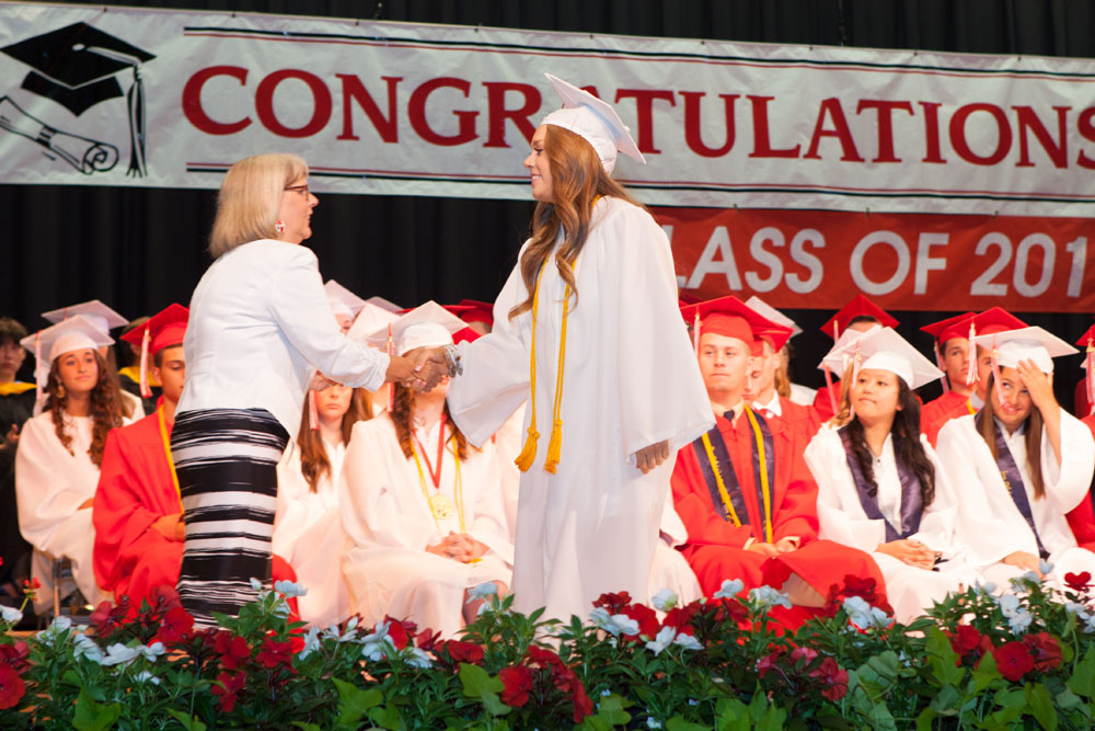Judi Fouchet, vice president of the Board of Education, hands out one of dozens of awards and scholarships.