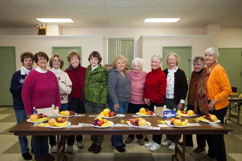 Southold Sunshine Society volunteers including coordinator Peggy Murphy, far right, preparing fruit plates Tuesday morning. (Katharine Schroeder photo)