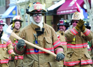 Volunteer firefighters march in last year's Presidents Day parade hosted by Greenport Fire Department. This year's march starts at 1 p.m. Saturday on Main Street.