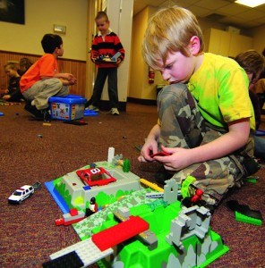 Jay Tramontana, 6, of Southold works on his creation at the Junior Lego Club meeting at Southold Free Library Tuesday morning.