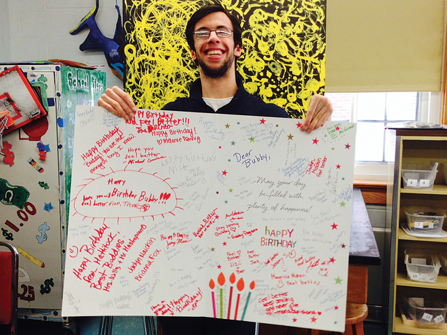 Nick Mele helped recruit as many classmates as possible to sign a huge birthday card for a disabled boy in Washington State. (Credit: Mattituck High School)