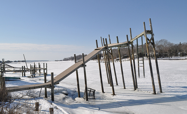 The historically cold winter, and the freezing and refreezing that came with it, have broken and splintered dozen, if not hundreds, of docks that line creeks and other Southold Town waterways. (Credit: Grant Parpan)