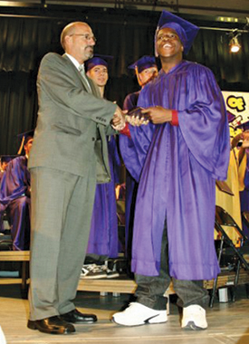 Michael Brown received a standing ovation at his Greenport High School graduation in 2008. (Credit: Greenport Yearbook)