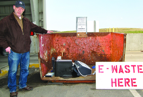 Southold Town solid waste coordinator Jim Bunchuck at the new free e-waste disposal area at the Cutchogue transfer station. Over the weekend the container had to be emptied twice each day as residents filled it with their old electronic equipment.