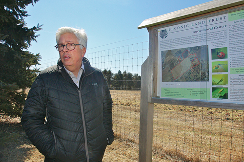 Peconic Land Trust vice president Timothy Caufield at the first property purchased for the group's ag center, the Charnews farm at 3005 Youngs Avenue in Southold. (Credit: Barbaraellen Koch)