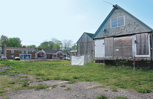 The former Galley Ho across the street from Legends and Summer Girl boutique on First Street’s New Suffolk Waterfront Fund land. (Credit: Barbaraellen Koch)