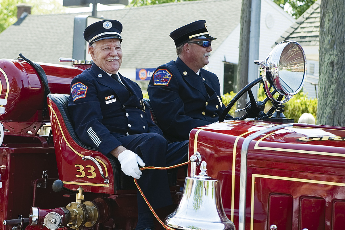 George Capon (left) and John Grilli in the truck during the Southold Town Memorial Day parade last week. (Credit: Katharine Schroeder)