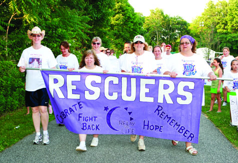 Greenport Rescue Squad members walk the track during last year's Southold Relay for Life.