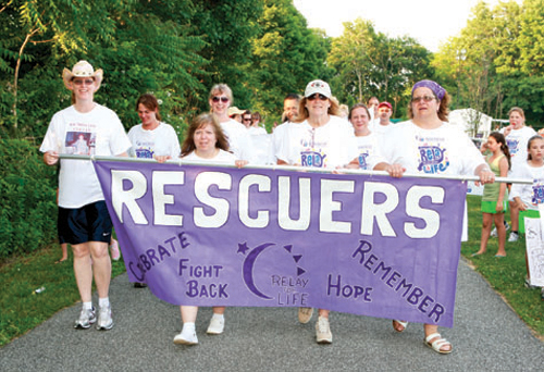 Greenport Rescue Squad members walk the track during at a Southold Relay for Life event. (Credit: Randee Daddona, file)