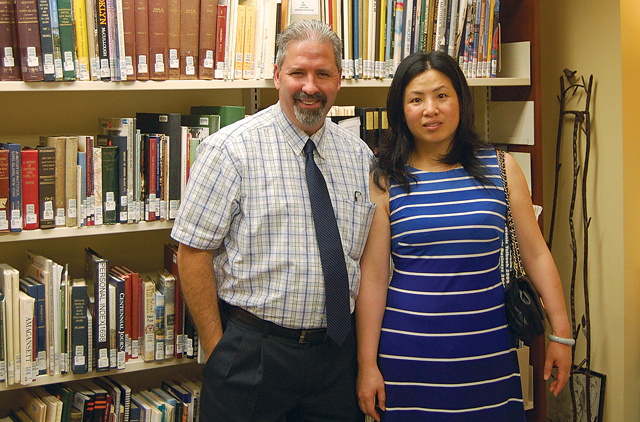 Mattituck-Laurel Library director Jeff Walden and Nancy Li, who passed the United States citizenship exam with the help of a program led by reference librarian Jerry Matovick. (Credit: Nicole Smith)