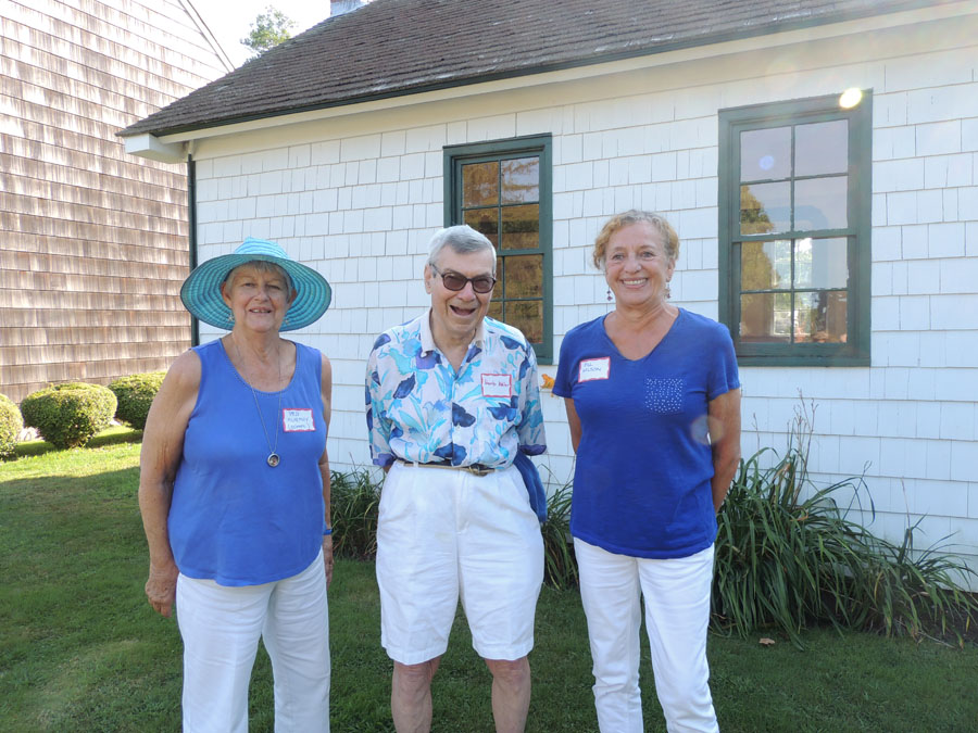 The Southold Historical Society's youth education committee chairperson Peggy Murphy, Board of Trustees president Herb Adler, and volunteer Jill Wilson in front of the old schoolhouse. (Credit: Claire Leaden)