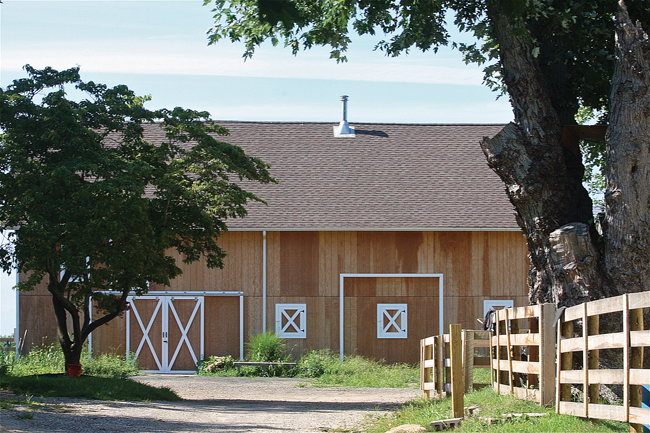 A stop-work order has been issued at the Showalter Farms property on Main Road in Mattituck, where this barn was resided and another pre-fab barn was delivered before the owners received building permits or site plan approval, town officials said. 