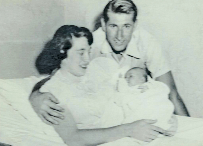 Thomas and Joan Young pose with their baby, Joan Elizabeth, at Eastern Long Island Hospital on the day she  was born in 1954. (Credit: Young Family)