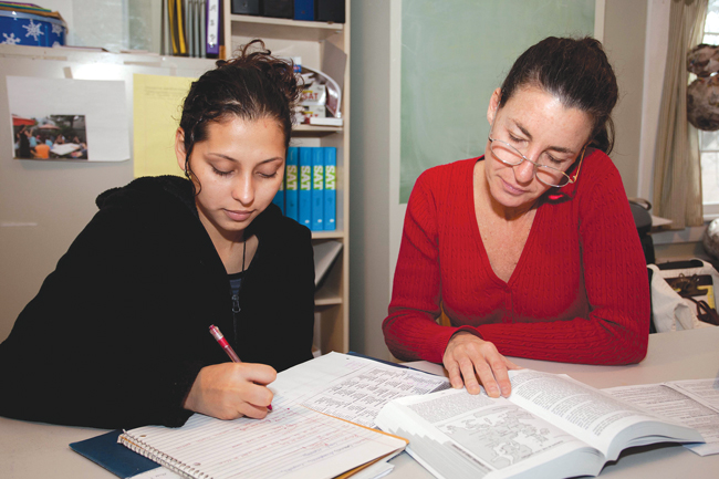 CAST has dedicated much of its resources to tutoring programs that allow students from underprivileged families access to adult mentors for help and homework. This photo, taken in 2011, shows a CAST tutor working with a fromer Greenport High School student. (Credit: Katharine Schroeder, file)