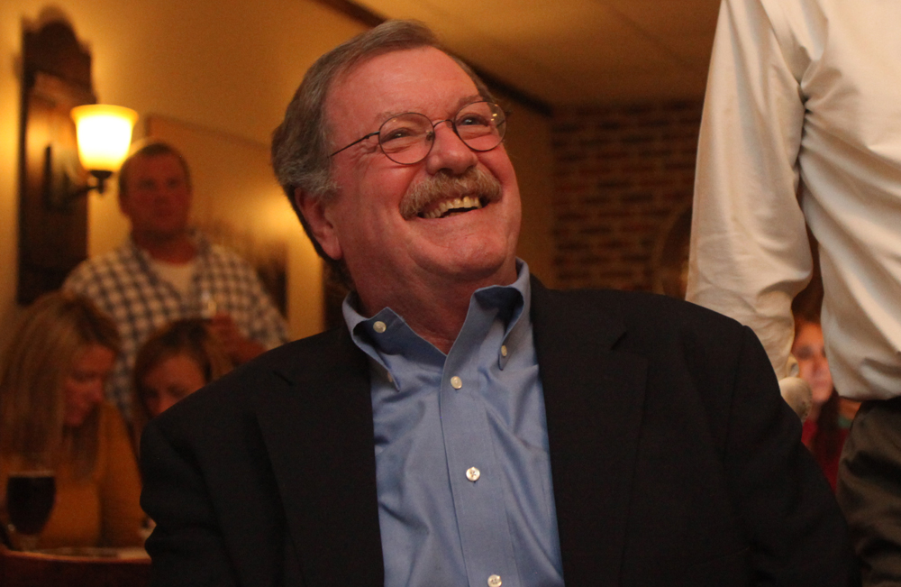 Democratic justice candidate Brian Hughes flashes a smile Tuesday night. (Credit: Chris Lisinski)