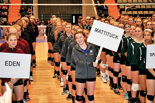 Meghan McKillop held Mattituck's sign as the Class C teams lined up during the opening ceremony at Glens Falls Civic Center. (Credit: Jim Ellis)