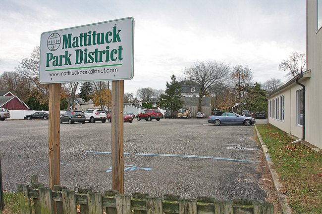 The Mattituck Park District says it must either sell this parking lot off Pike Street or develop it as parkland. (Credit: Barbaraellen Koch)