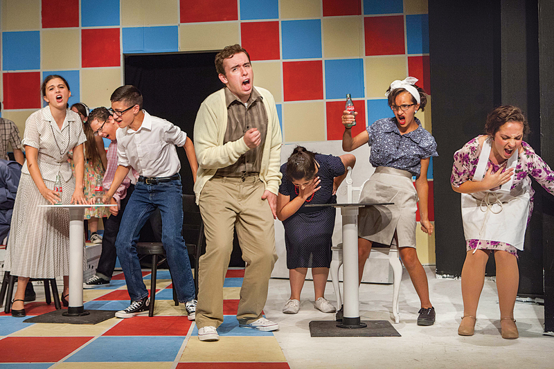 Cast members of 'All Shook Up,' the current Youth on Stage show at North Fork Community Theatre, sing 'Heartbreak Hotel' in the production directed by Brett Chizever. (Credit: Katharine Schroeder)