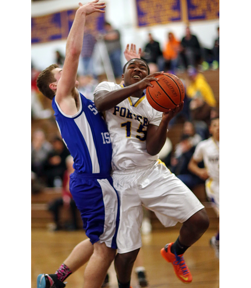 Tyshie Williams drives to the basket against Shelter Island Friday night. (Credit: Garret Meade)
