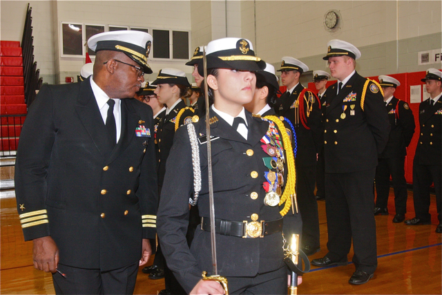 Cadet staff Cadet Commander Andreana Mineo leads Commander Jimmie Miller as he inspects Cadet staff.