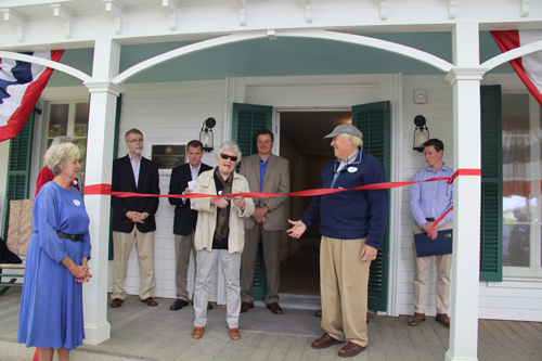 Fredrica Wachsberger, former president of the society who began working on the project over a decade ago, cuts the ribbon Saturday afternoon. (Credit: Carrie Miller)