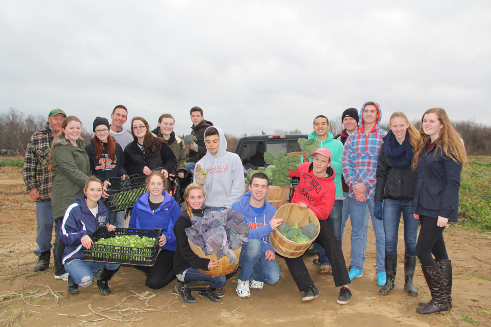 The Southold High School Honor Society at Wesnofske Farm on Tuesday. (Credit: Carrie Miller)