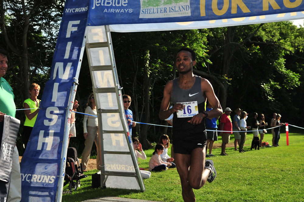 Yonas Mebrahtu crosses the finish line first at the 35th annual Shelter Island 10K Saturday. (Credit: Bill Landon)
