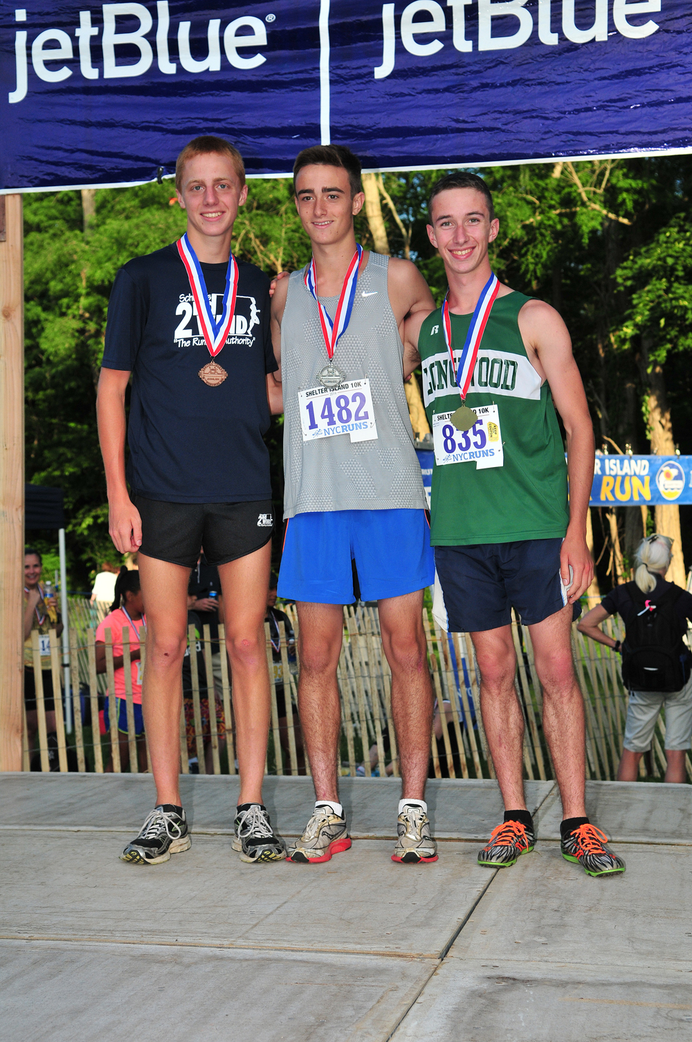 Keith Steinbrecher of Shoreham-Wading River High School, Nicholas Sherman of Huntington High School and Zachary Malik of Longwood High School finished third through first in the 19U male age group. (Credit: Bill Landon)