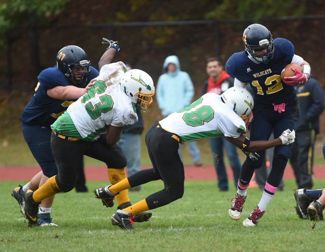 A Wyandanch player makes a tackle during the team's 54-0 loss to Shoreham-Wading River Oct. 11. (Credit: Robert O'Rourk)