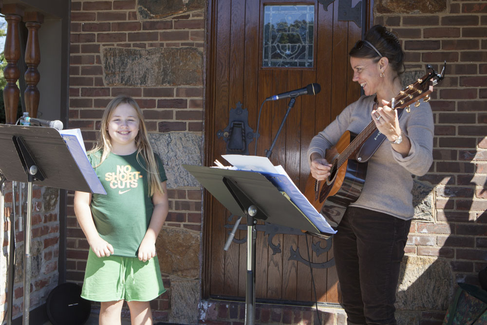 Maya Hamilton, 10, of Cutchogue sings with Patti Homan.