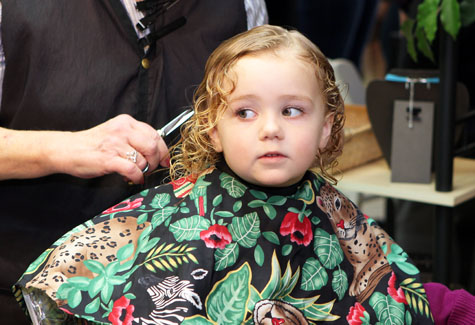 Bridget Mulrain, 3, of Mattituck prepares for the first snip of the Fourth Annual Hope for a Cure Cut-A-Thon on Southold Saturday.