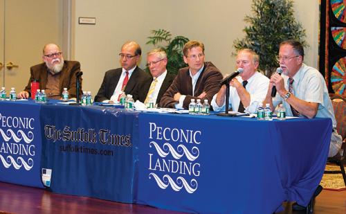 KATHARINE SCHROEDER PHOTO | Trustee candidates debate issues like water pollution and beach access during Tuesday's forum.
