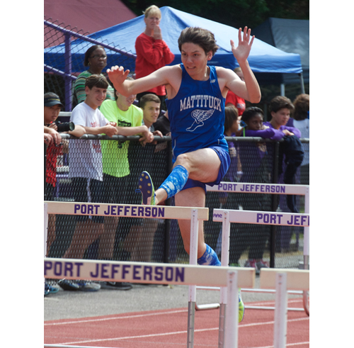 Mattituck junior Jack Dufton runs the 110-meter hurdles Friday in the pentathlon. (Credit: Robert O'Rourk)