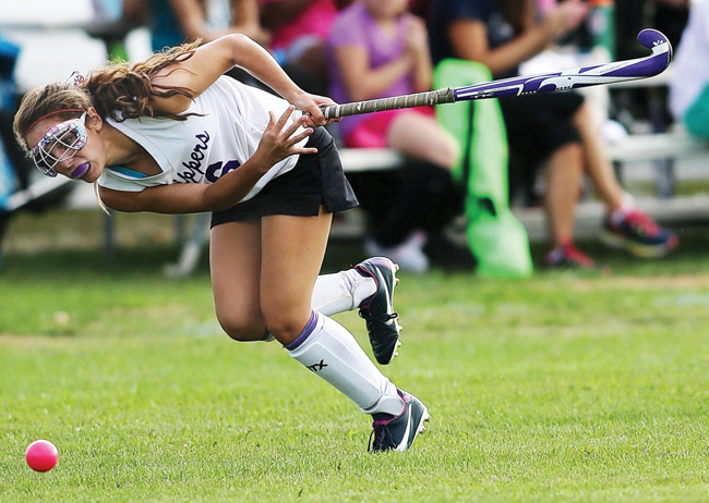 Toni Esposito of Greenport/Southold, following through on a hit. (Credit: Garret Meade)